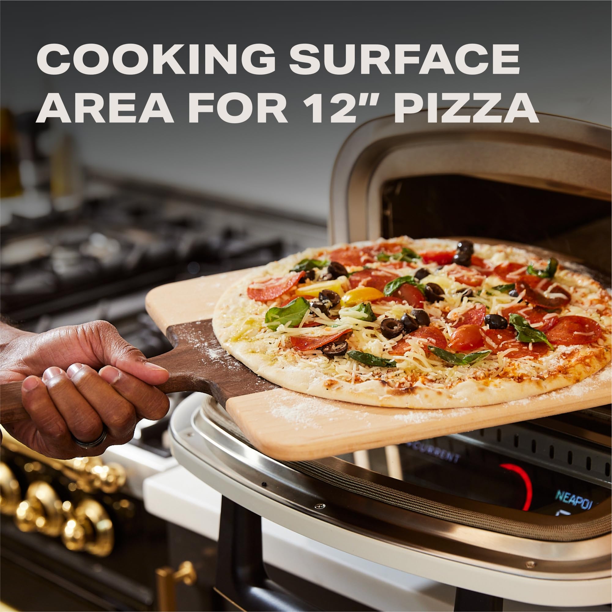 Current® Model P in use with bubbling cheese demonstrating fast high-heat cooking benefit