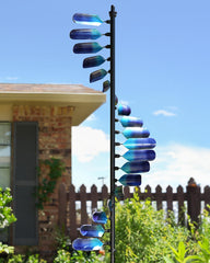 Cyan Oasis front view of peacock spiral showing dynamic motion and color