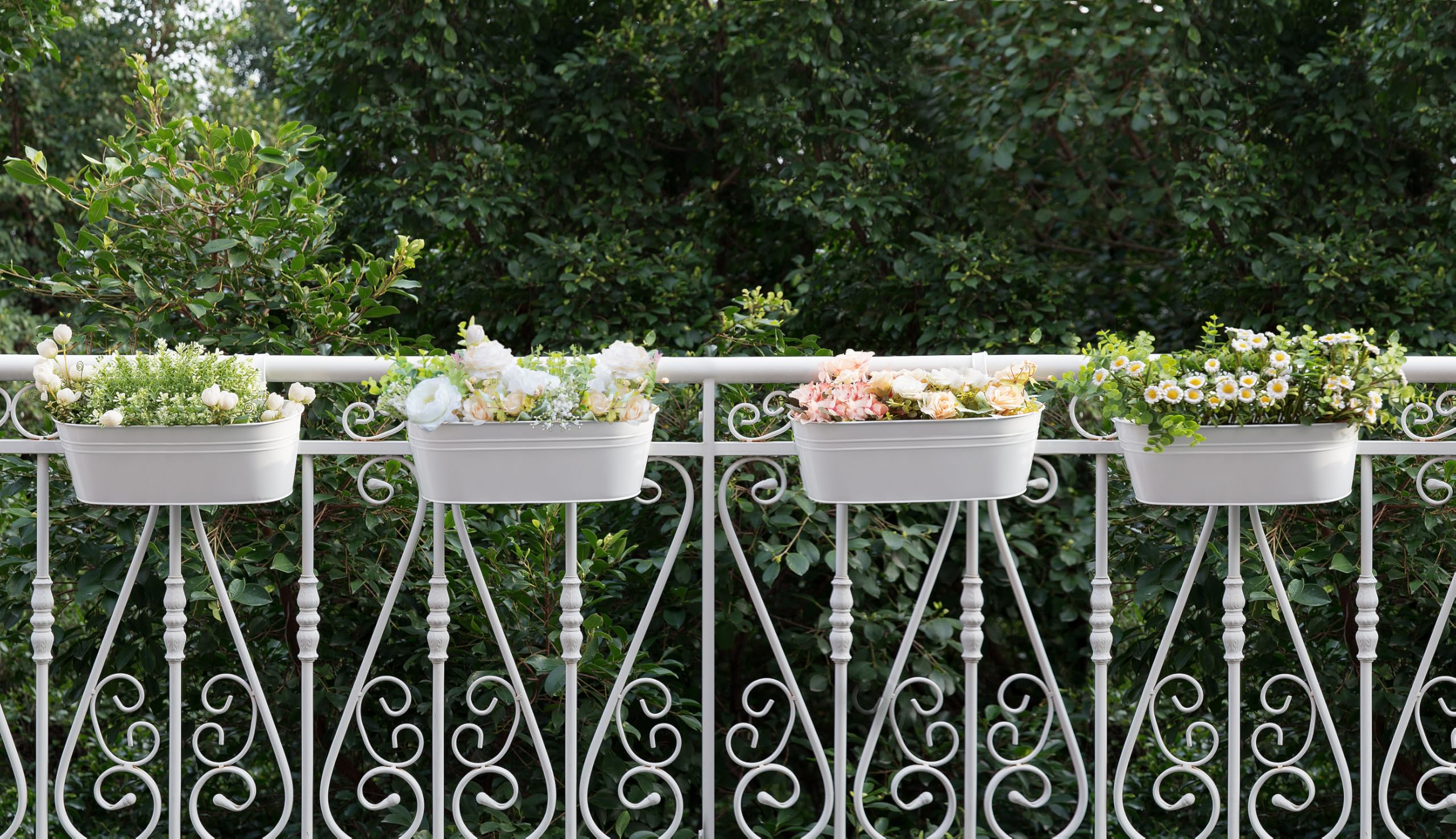 Dahey lifestyle deck arrangement with planters brightening outdoor seating area