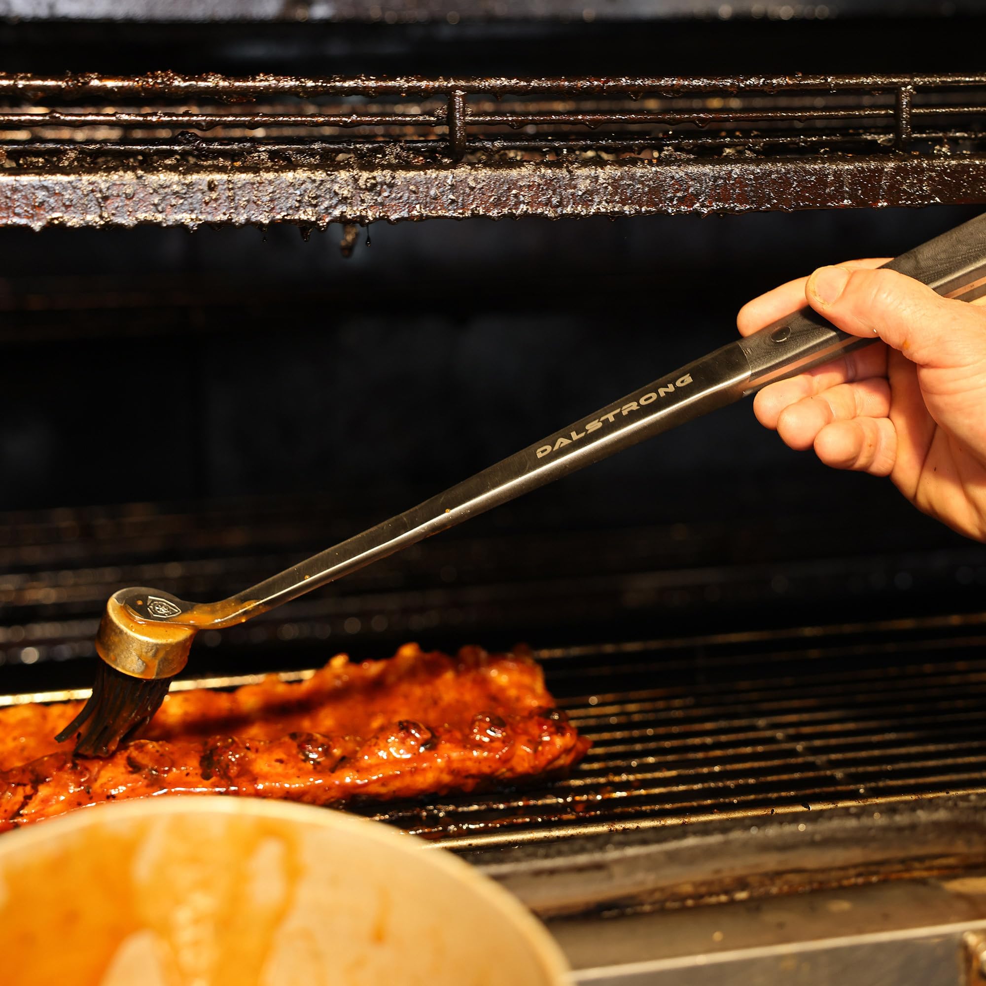 Dalstrong kit in backyard lifestyle scene enabling effortless party grilling