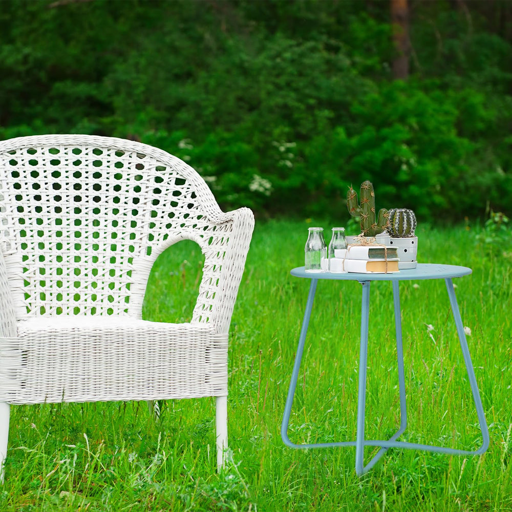 danpinera table next to lounge chair offering convenient drink surface