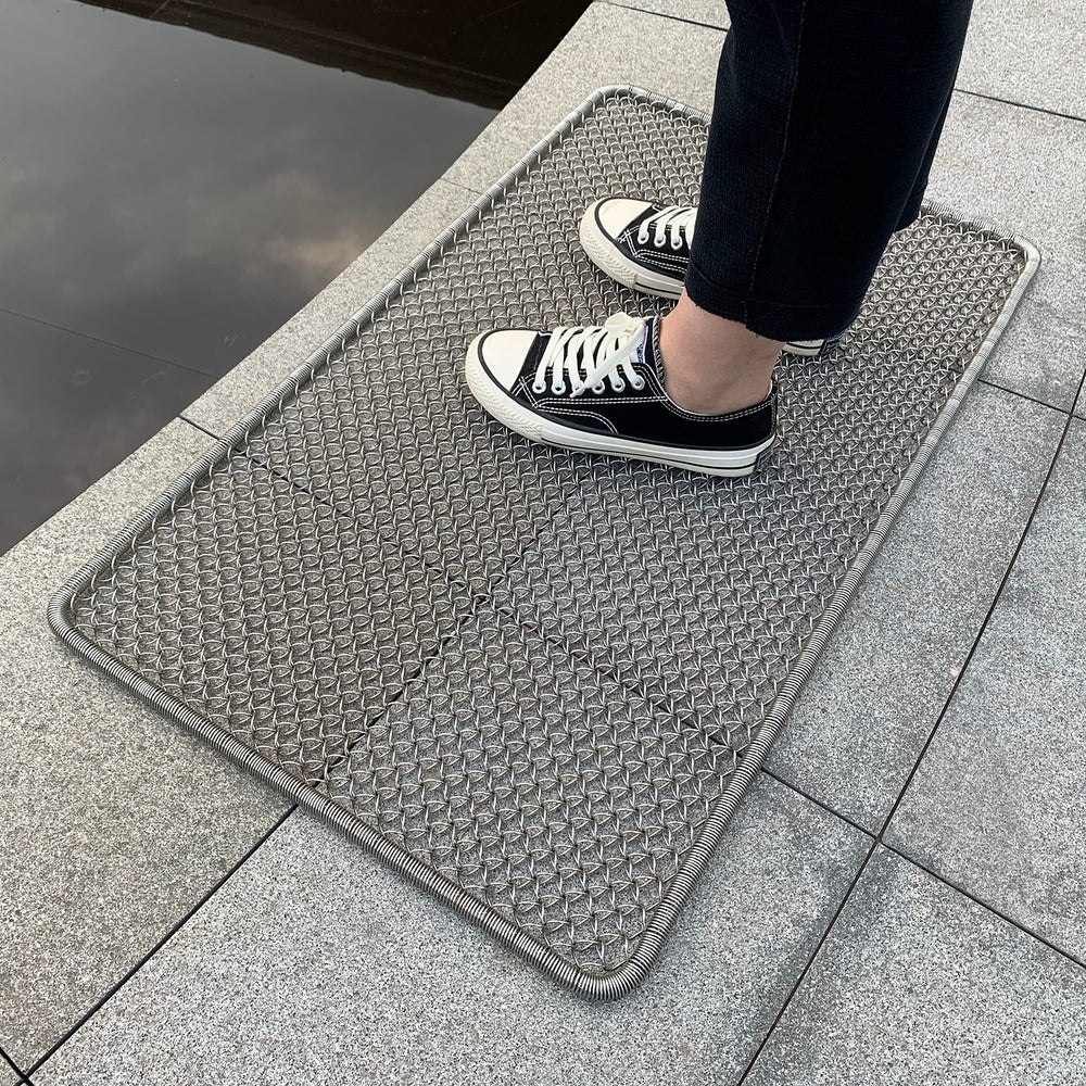 DAOMAER front view of metal doormat showing sturdy scrape surface and entry protection