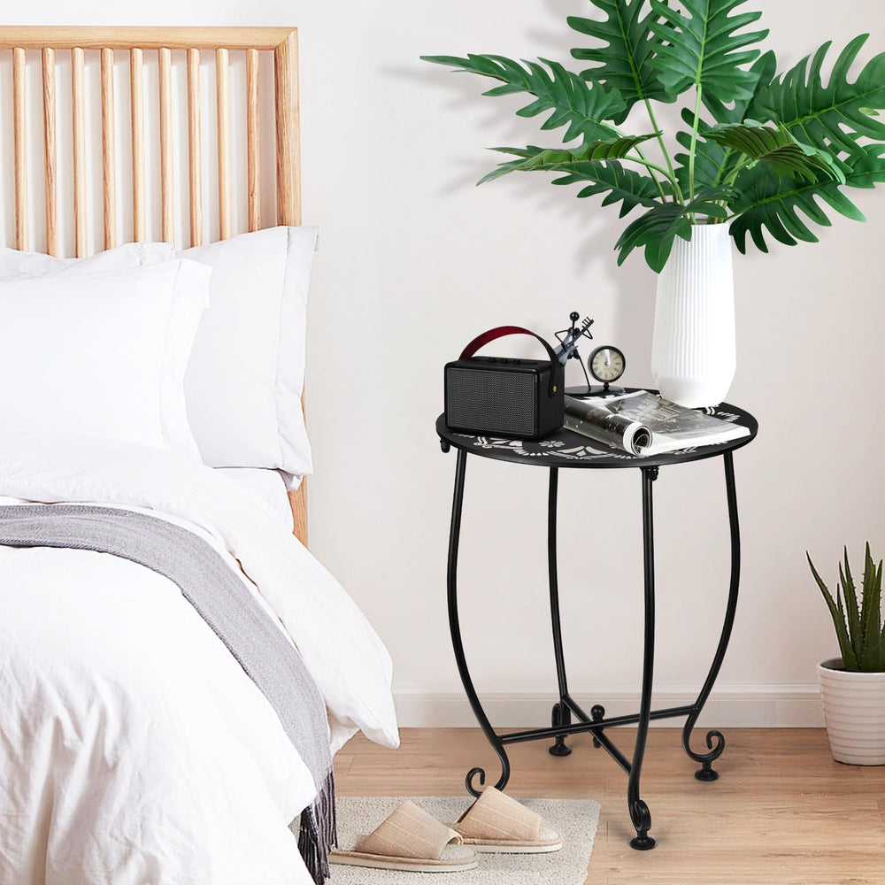 DARCKLE table holding plant and drink to show practical surface for patio items