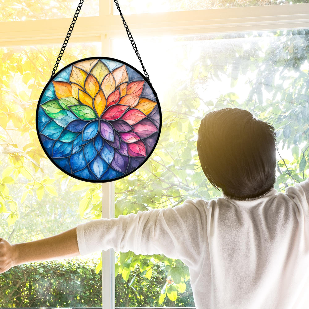 DASTOLL hung in sunlit window creating colored light reflections