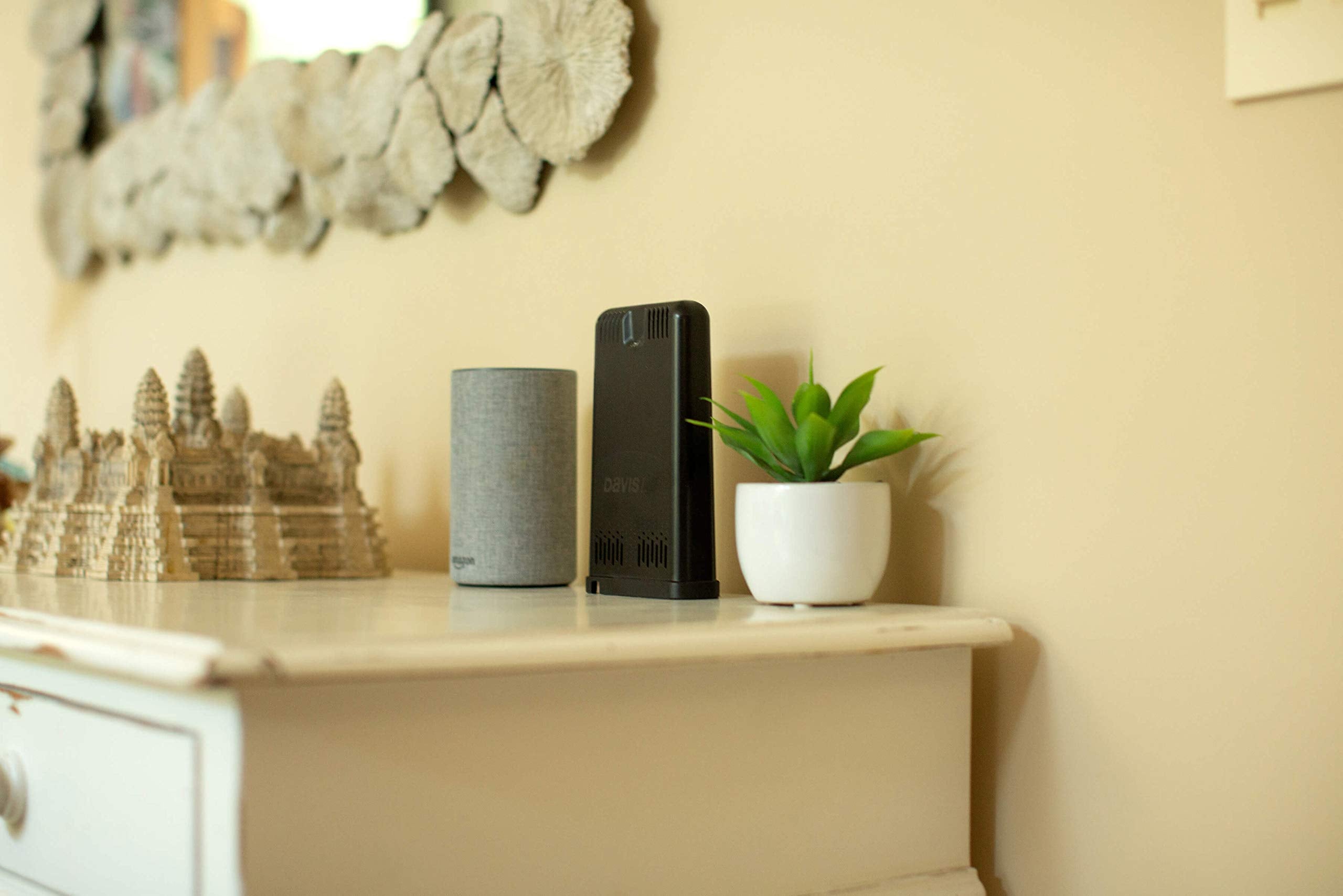 Davis Instruments 6100 next to a smartphone for scale and easy home placement