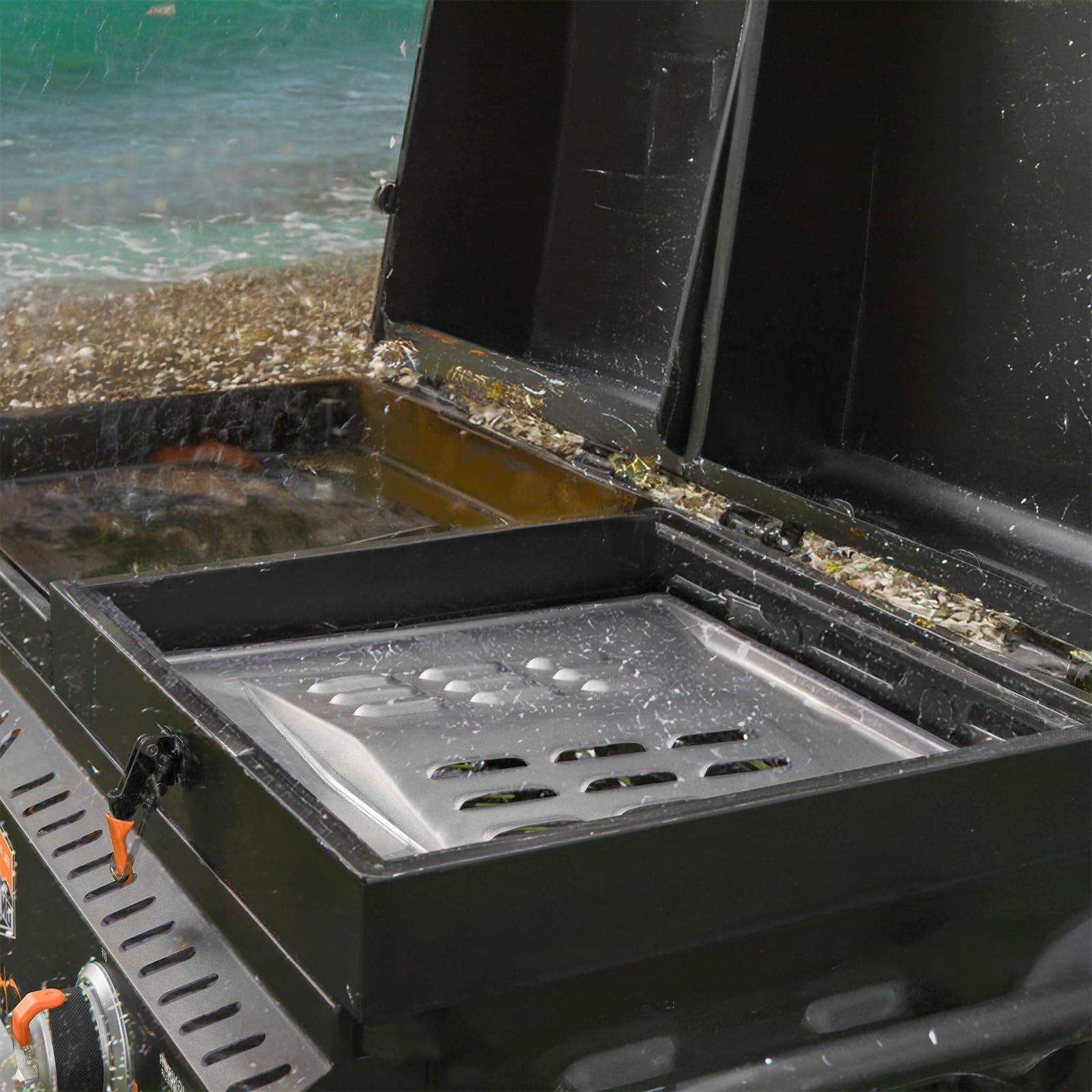 DcYourHome outdoor camping griddle setup showing the heat shield improving cooking reliability