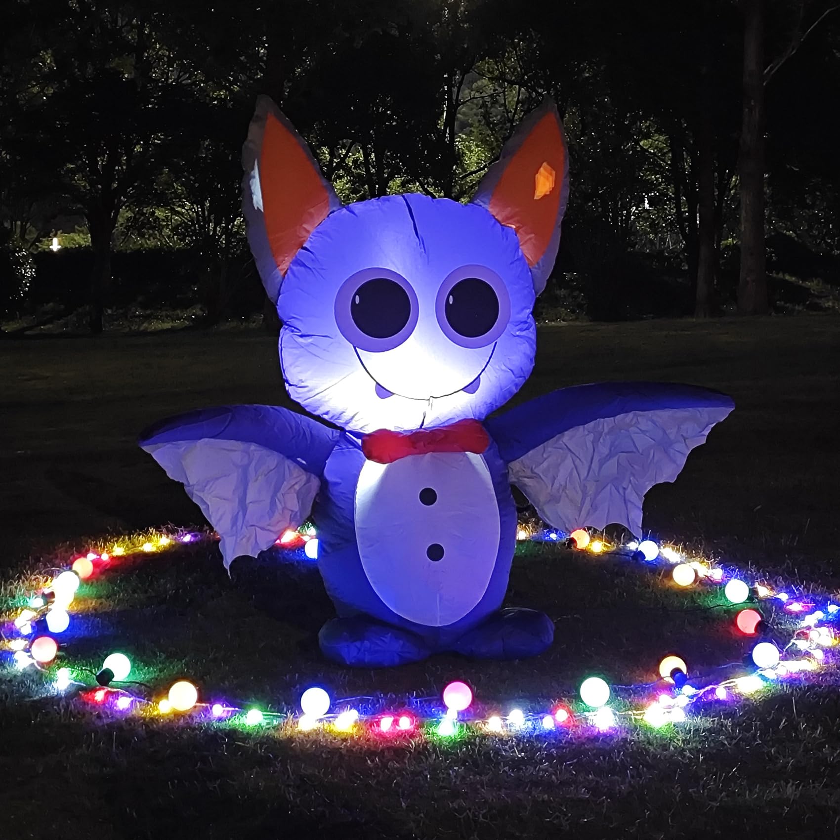 DearSun yard display at night creating festive curb appeal