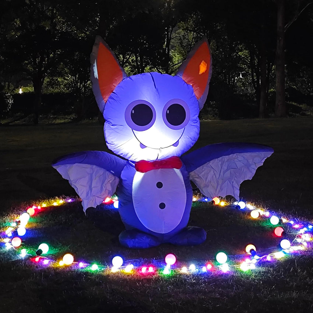 DearSun yard display at night creating festive curb appeal