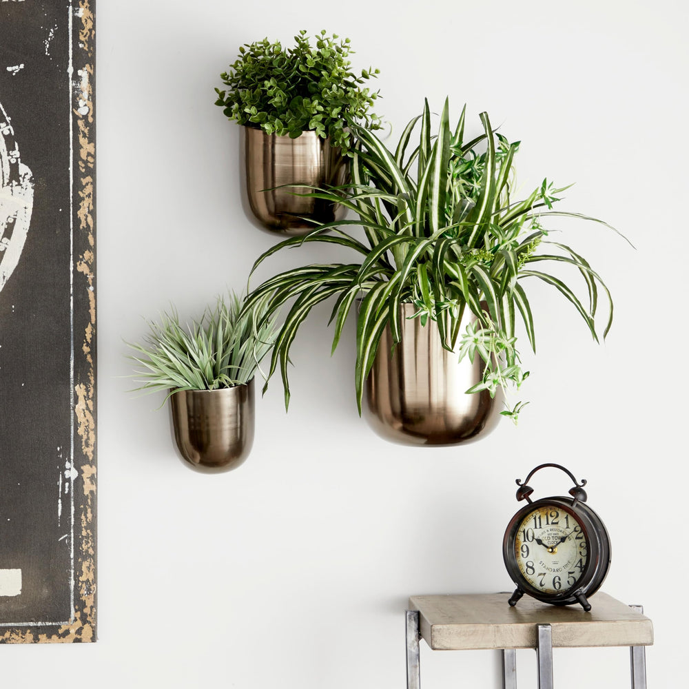 deco 79 front view showing three black hanging planters, enhances modern décor