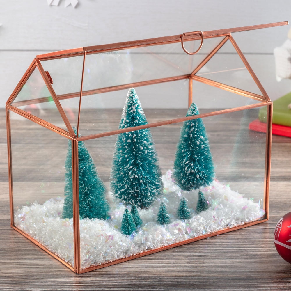 D'Eco glass house centerpiece on dining table enhancing décor