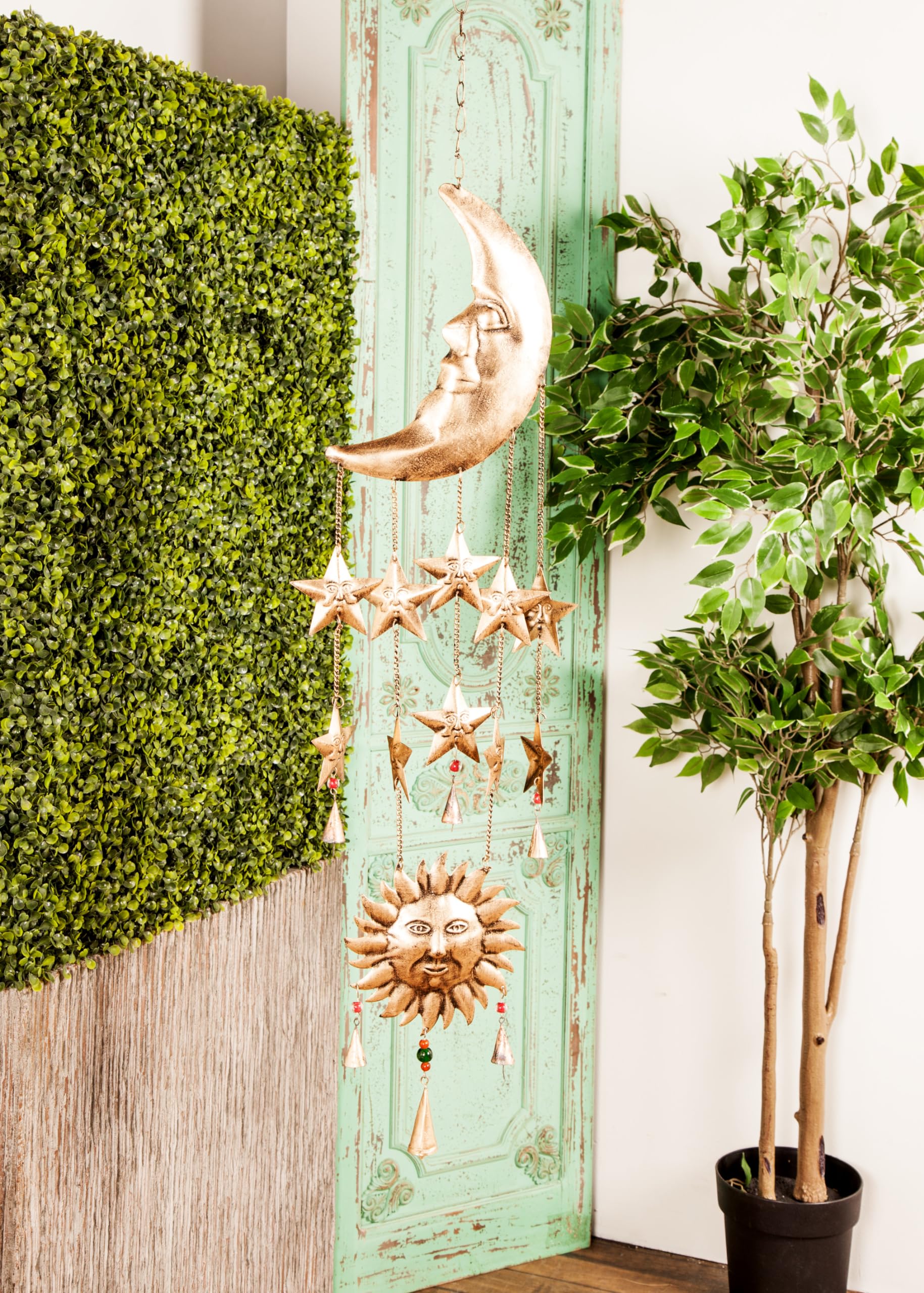 deco 79 windchime hanging in a window conveys decorative sparkle and ambient sound benefit