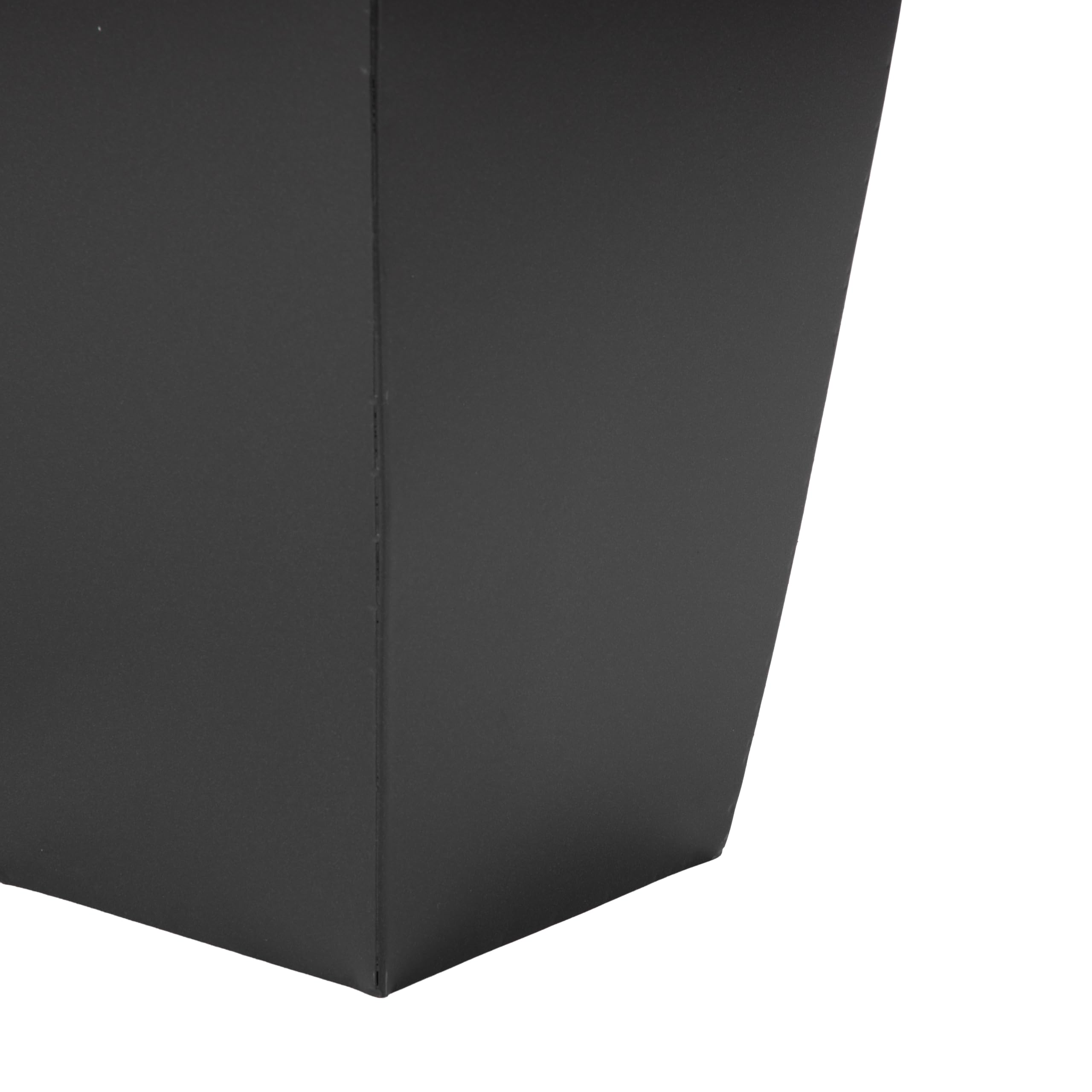 deco 79 planters next to chair showing scale and placement benefit