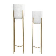 deco 79 gold-colored removable stand detail offering stable elevation
