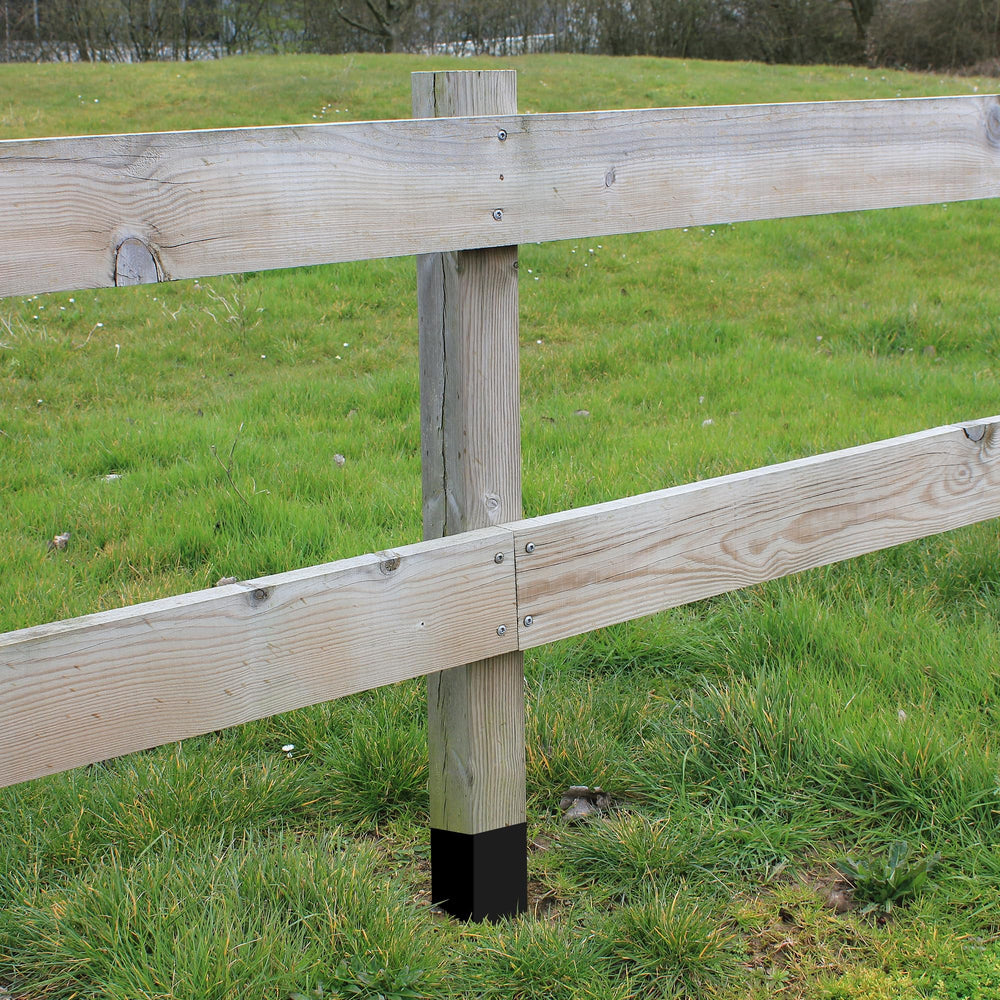 DECOHS wrapped posts in backyard fence illustrating long-lasting weather protection
