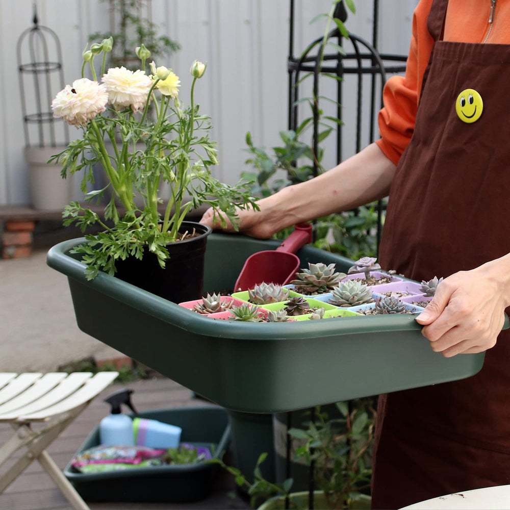 Defemim tray being used to mix potting soil, reducing mess