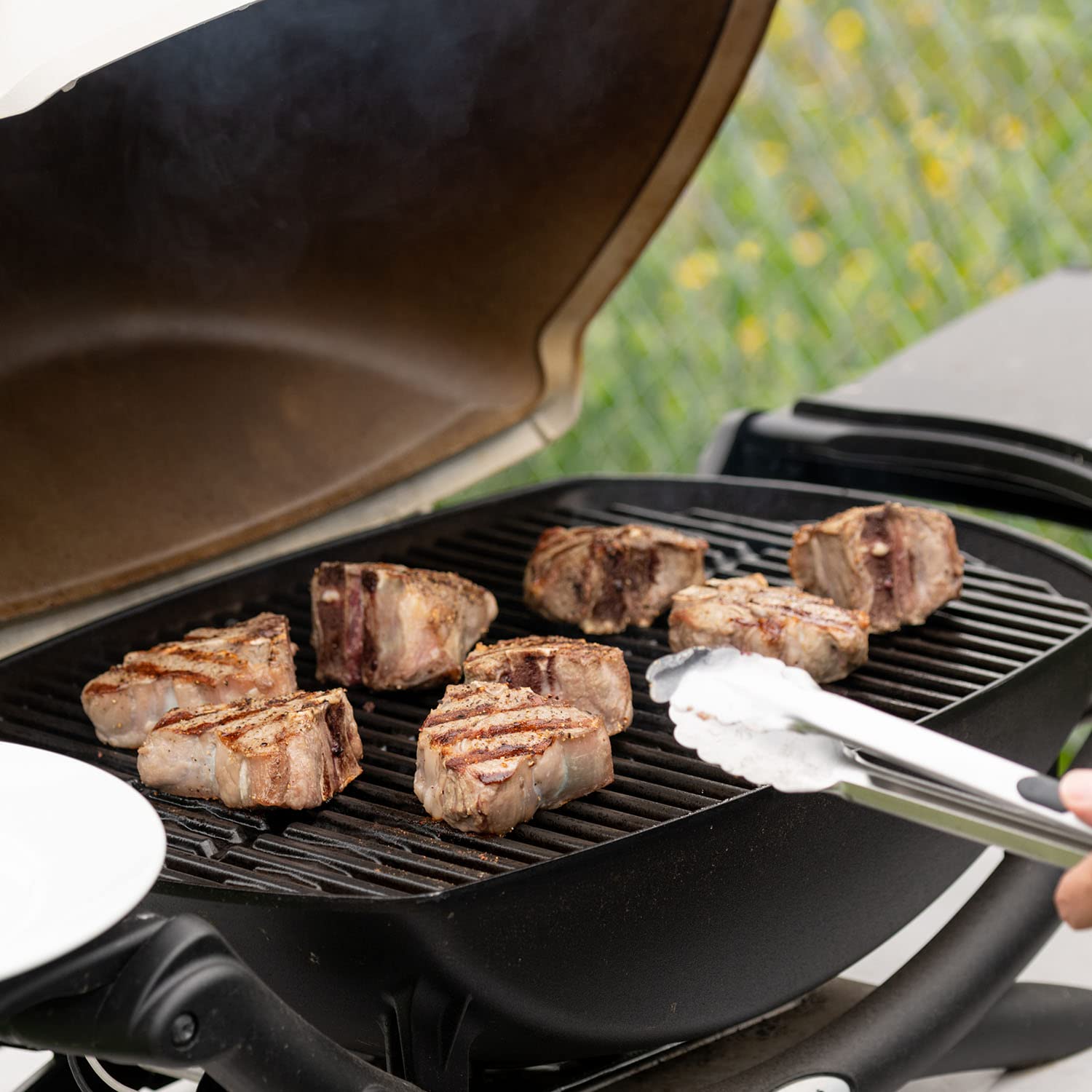 DELSbbq grill in backyard lifestyle scene illustrating reliable cooking