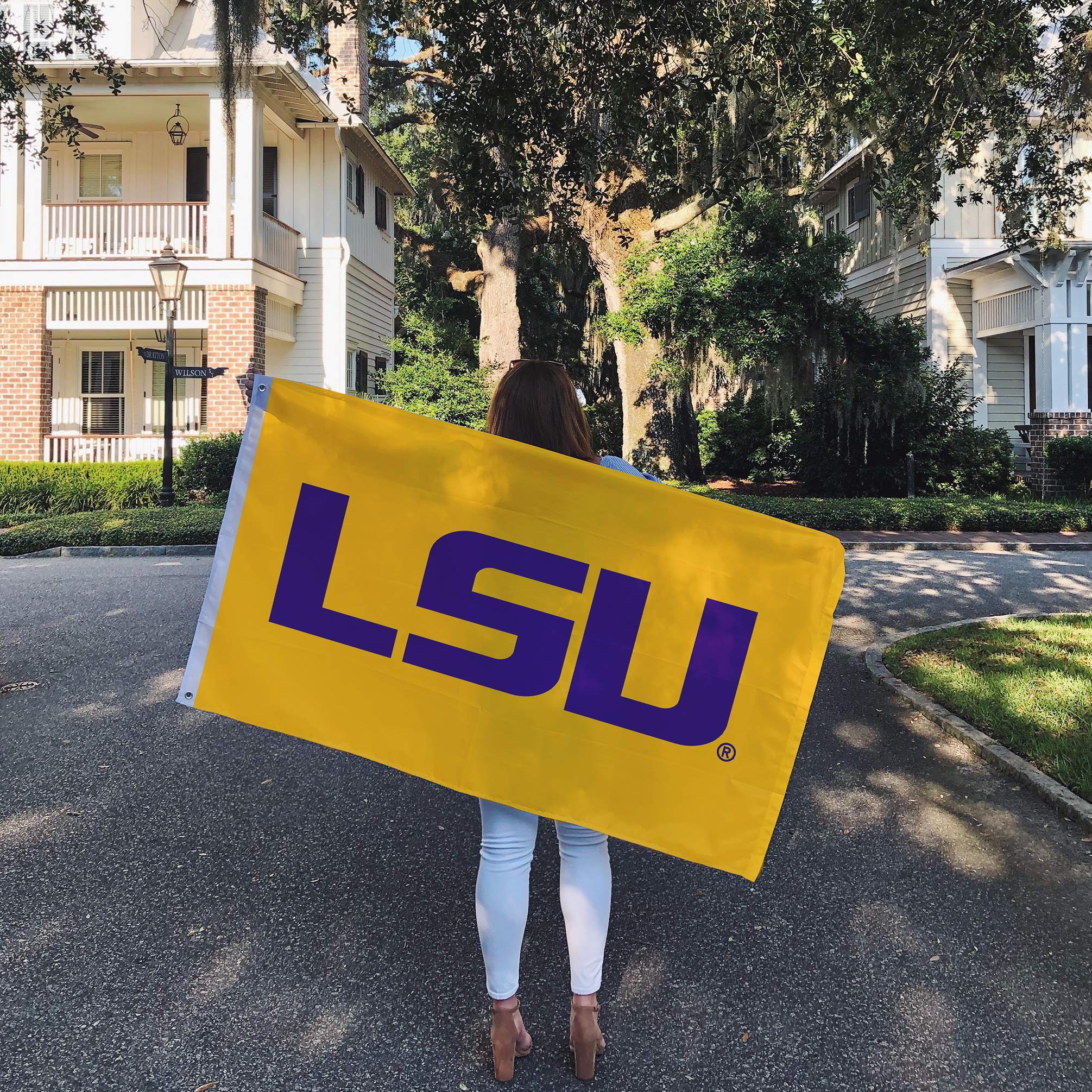 Desert Cactus LSU flag hanging on a porch adding official-school pride to home