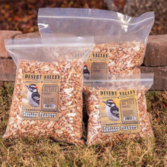 Desert Valley Supply peanuts in hand beside ruler showing 5 lb bag size and scale