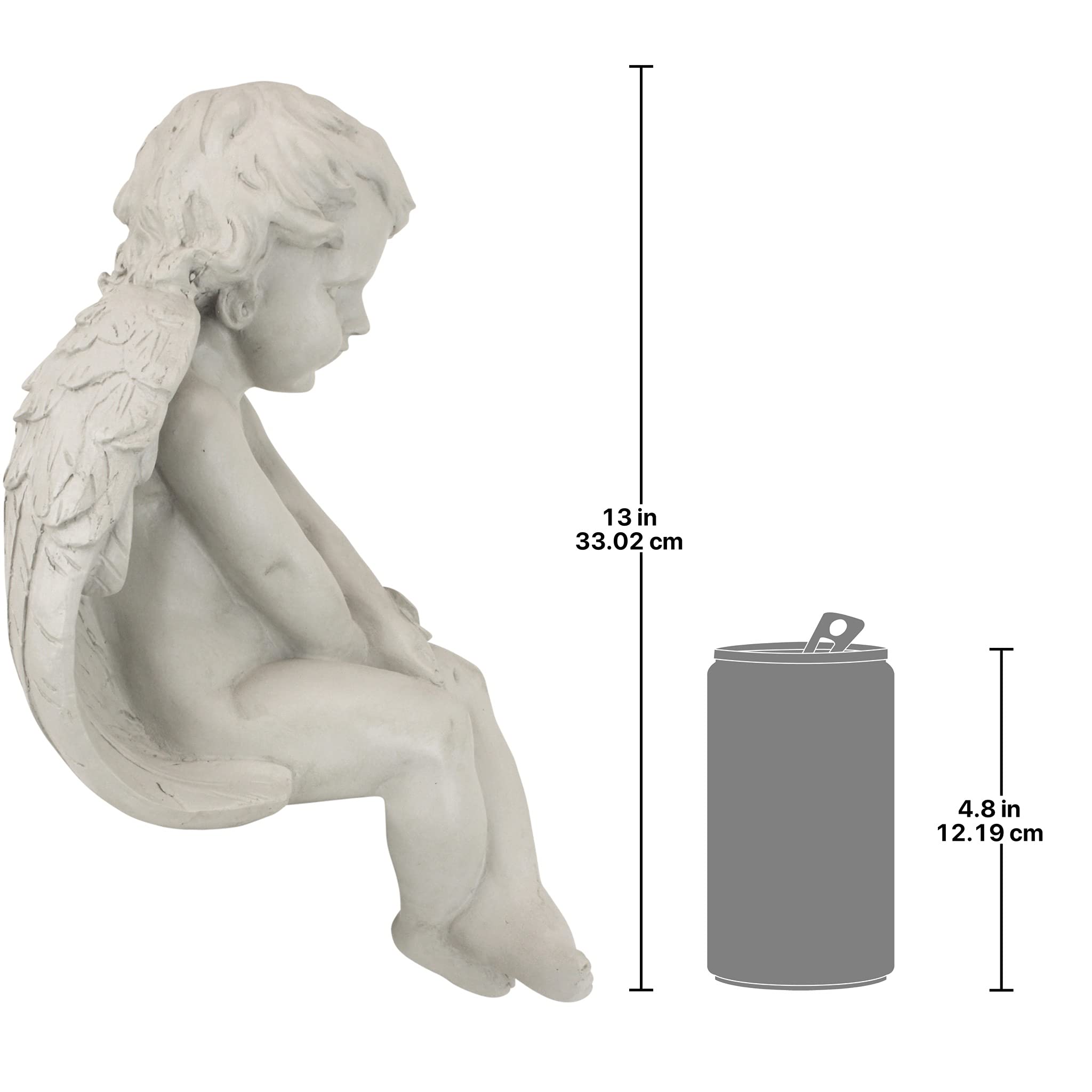 Design Toscano angel beside books demonstrating compact size and scale