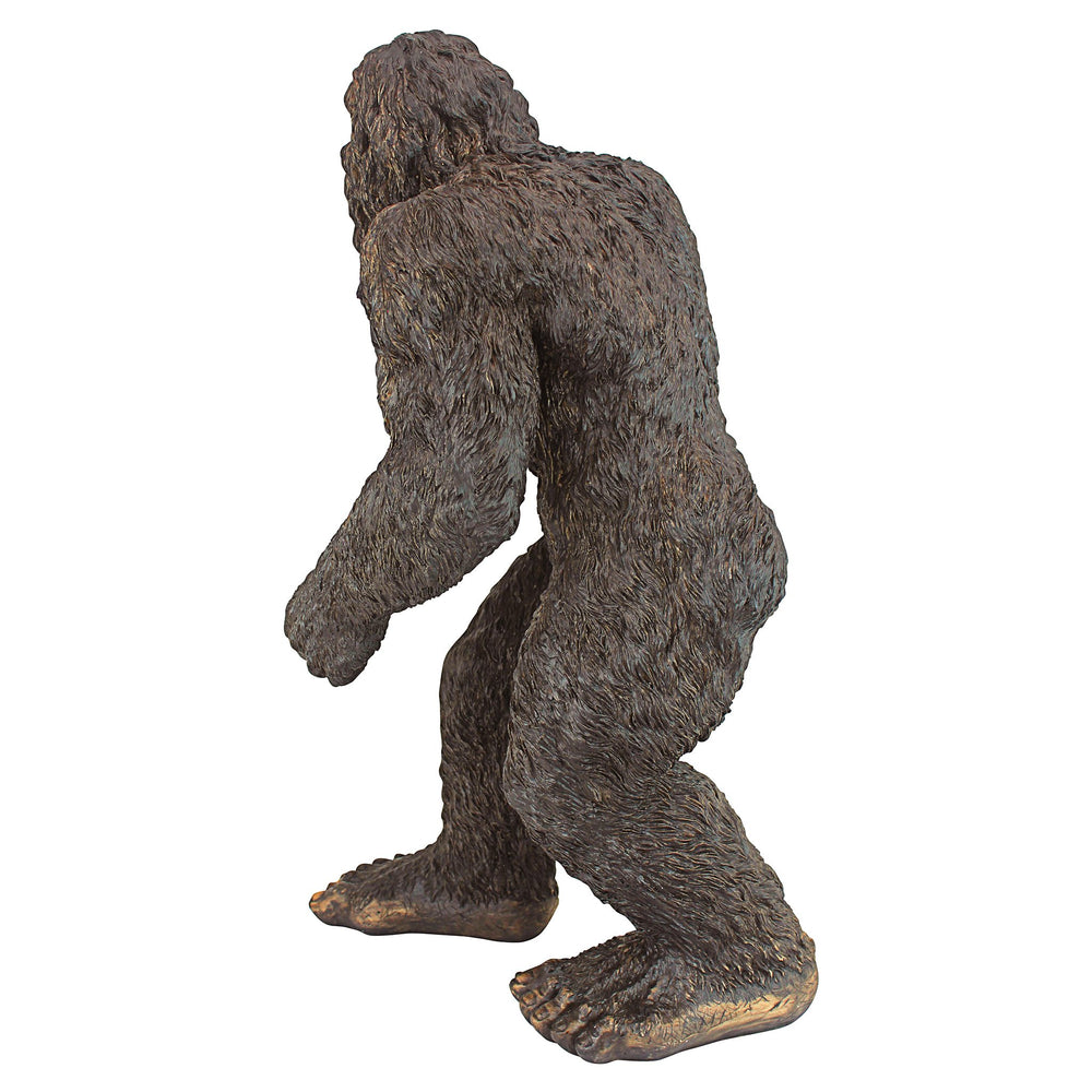 Design Toscano garden setting Bigfoot positioned among plants to add whimsy
