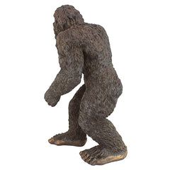 Design Toscano garden setting Bigfoot positioned among plants to add whimsy