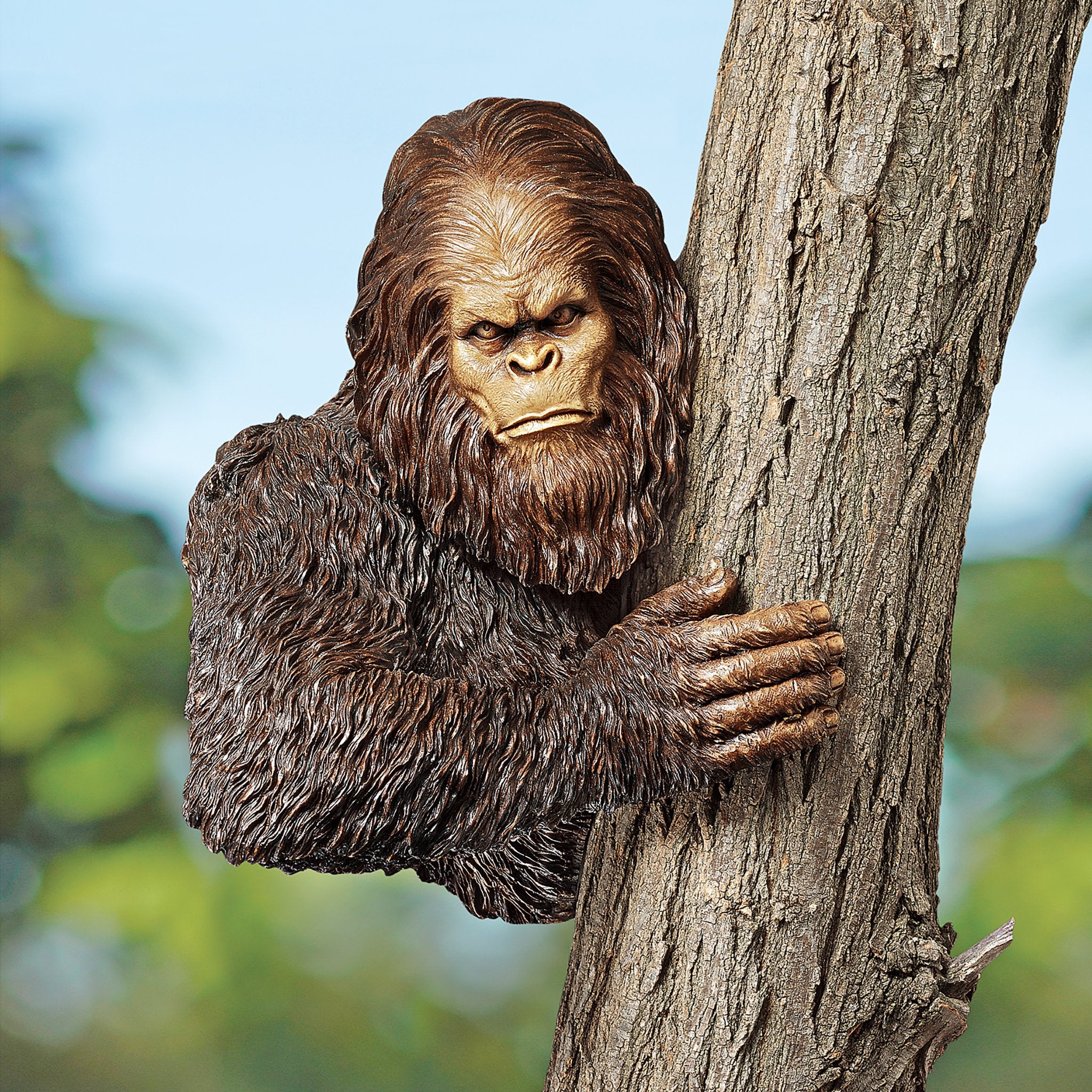 Design Toscano Bigfoot next to potted plant showing scale and easy placement