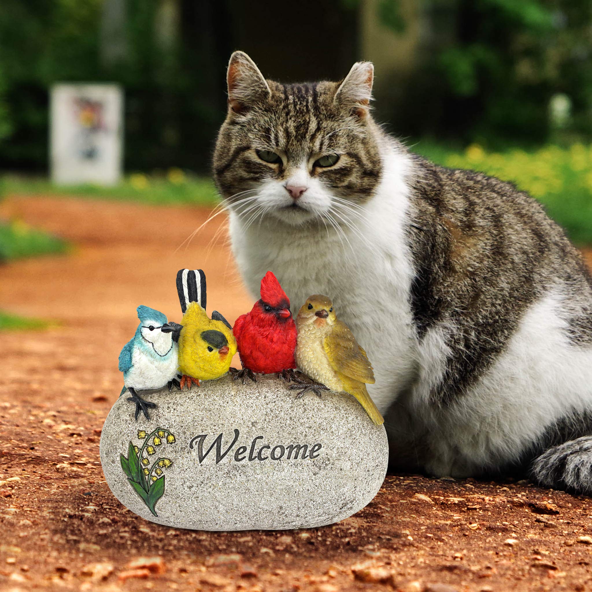 Design Toscano statue nestled in a flowerbed adding garden charm