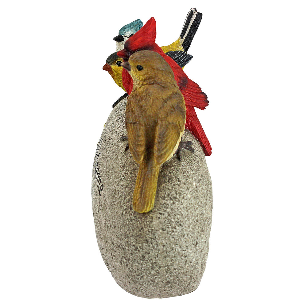 Design Toscano bird statue displayed on a front step to welcome guests