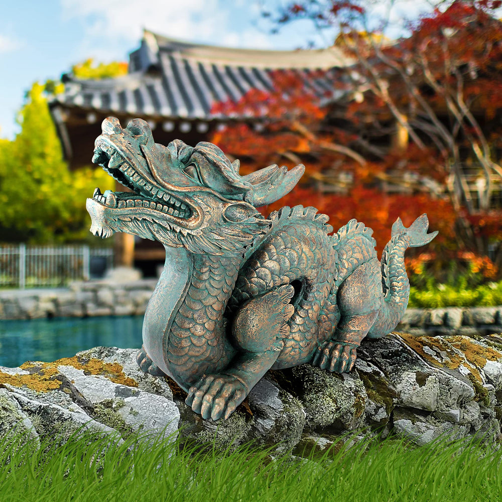 Design Toscano label and verdigris finish detail showing craftsmanship and durable look