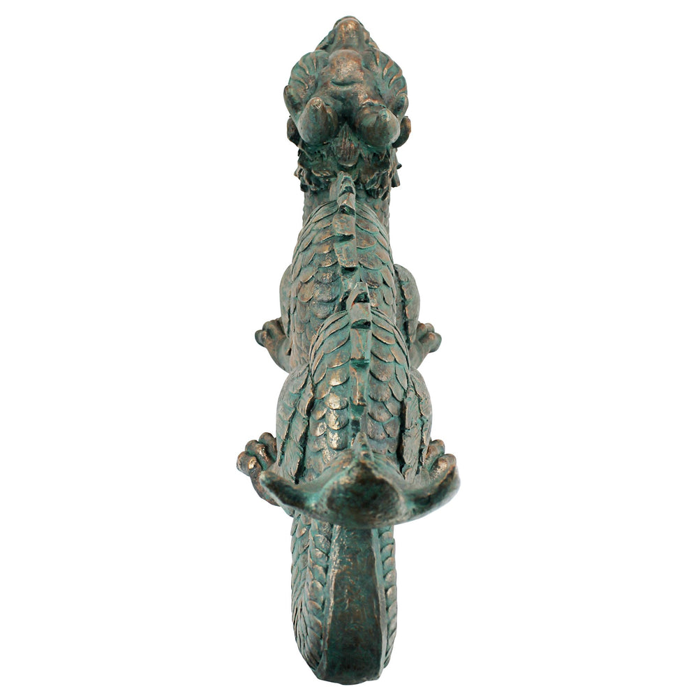 Design Toscano dragon at pond edge demonstrating waterside accent and visual balance