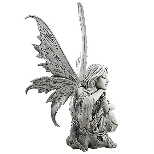 Design Toscano fairy statue displayed on pedestal to elevate focal point