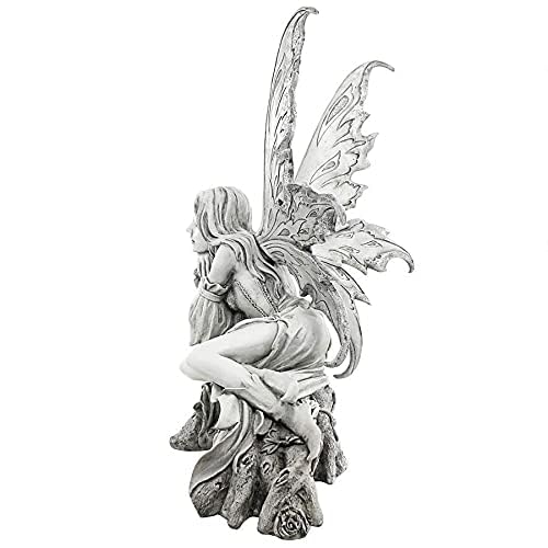 Design Toscano fairy statue in hand to show scale and easy portability