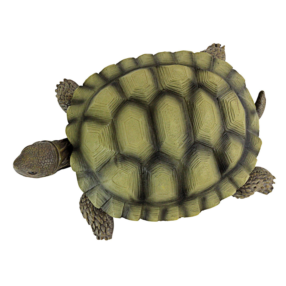 Design Toscano Gilbert beside a hand to show compact 9-inch scale