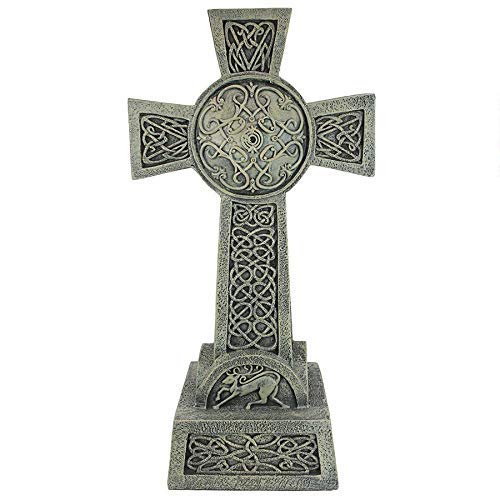 Design Toscano finished cross installed in garden offering serene memorial or decorative appeal