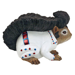 Design Toscano statue placed in a garden adding whimsical focal interest