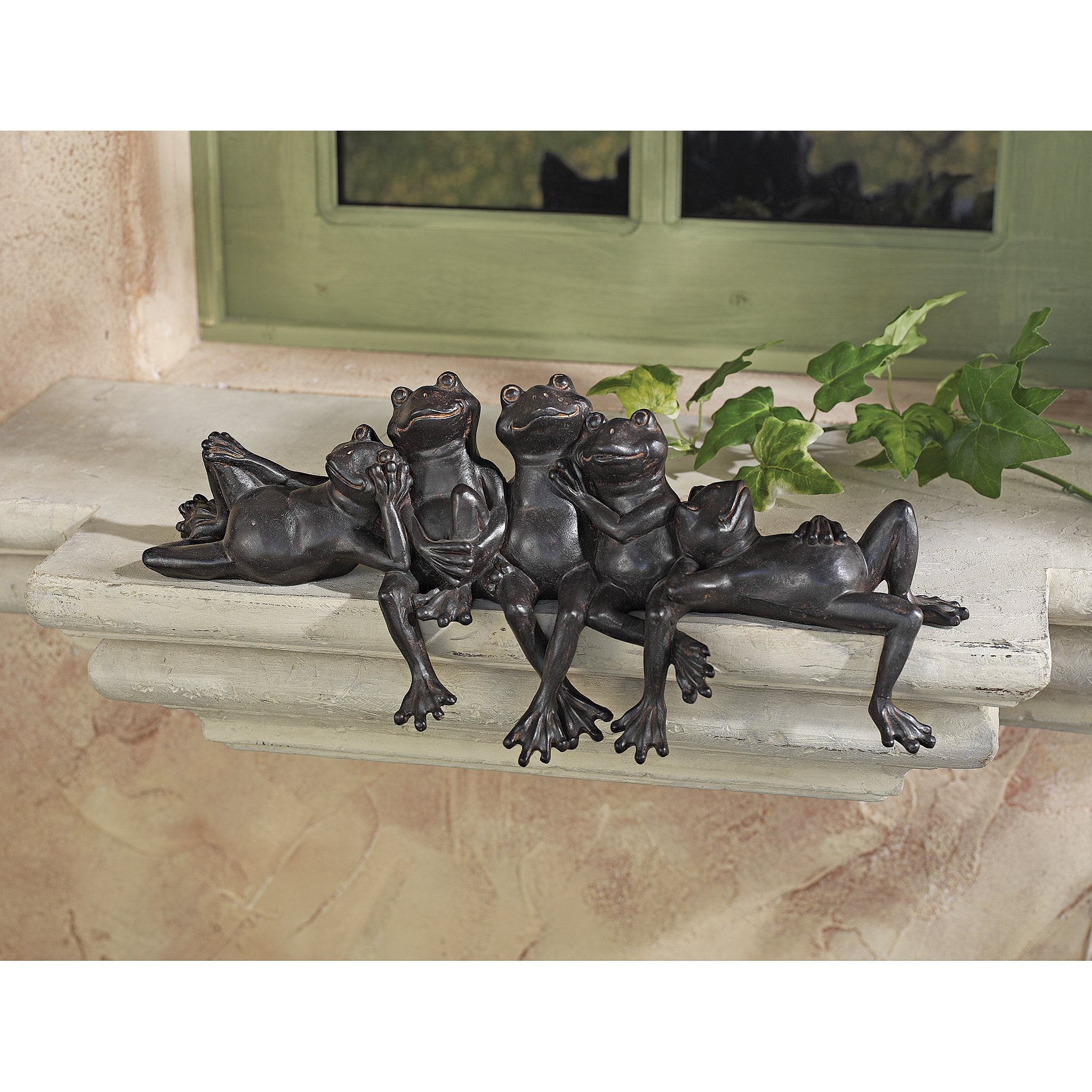 Design Toscano statue beside a ruler showing compact 15½ inch width