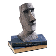 Design Toscano moai statue staged on patio table showing compact size and atmospheric accent