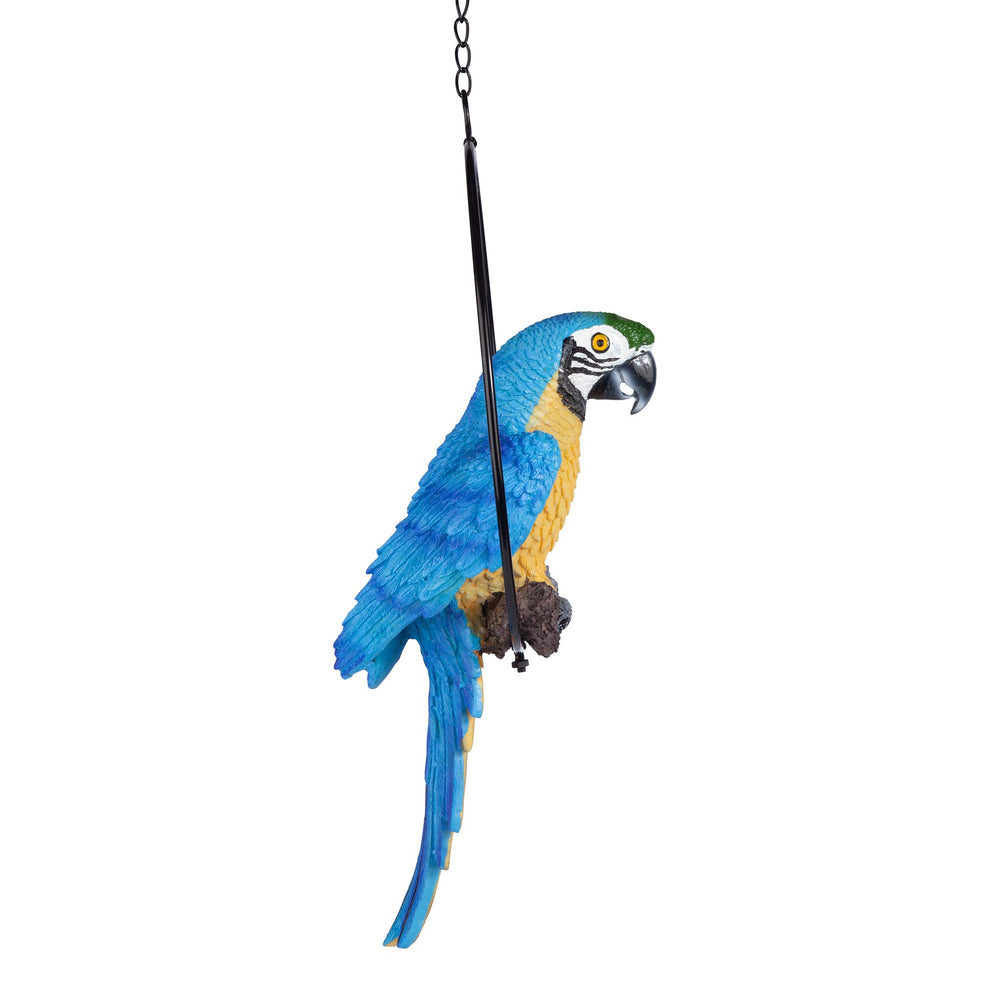 Design Toscano parrot next to hand showing size and light hanging weight benefit