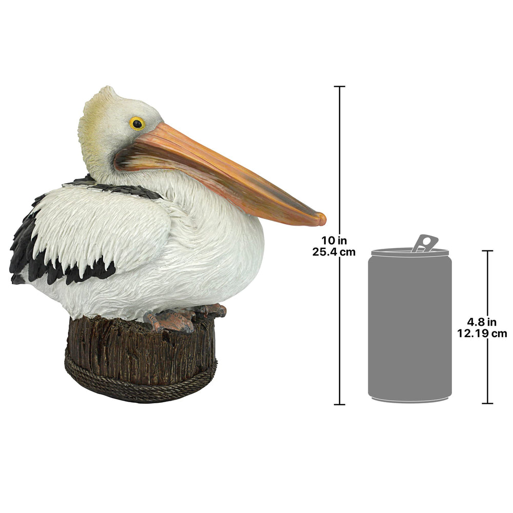 Design Toscano pelican positioned by pond demonstrating natural setting enhancement