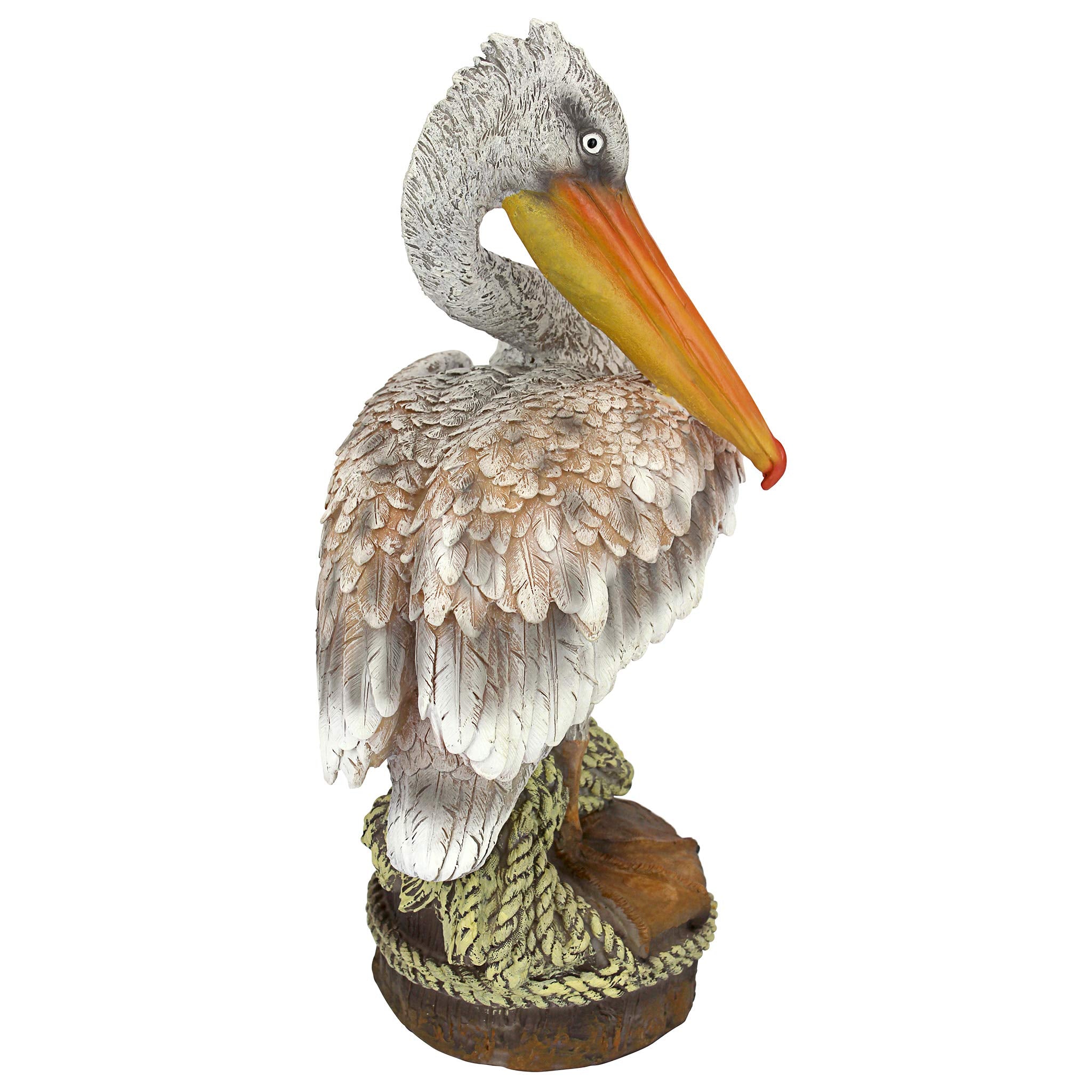 Design Toscano pelican near pond showing weather-resistant decorative use