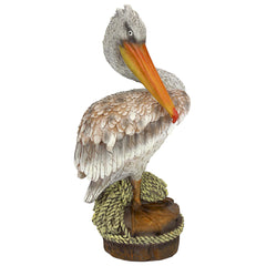 Design Toscano pelican front view showing coastal accent and durable finish