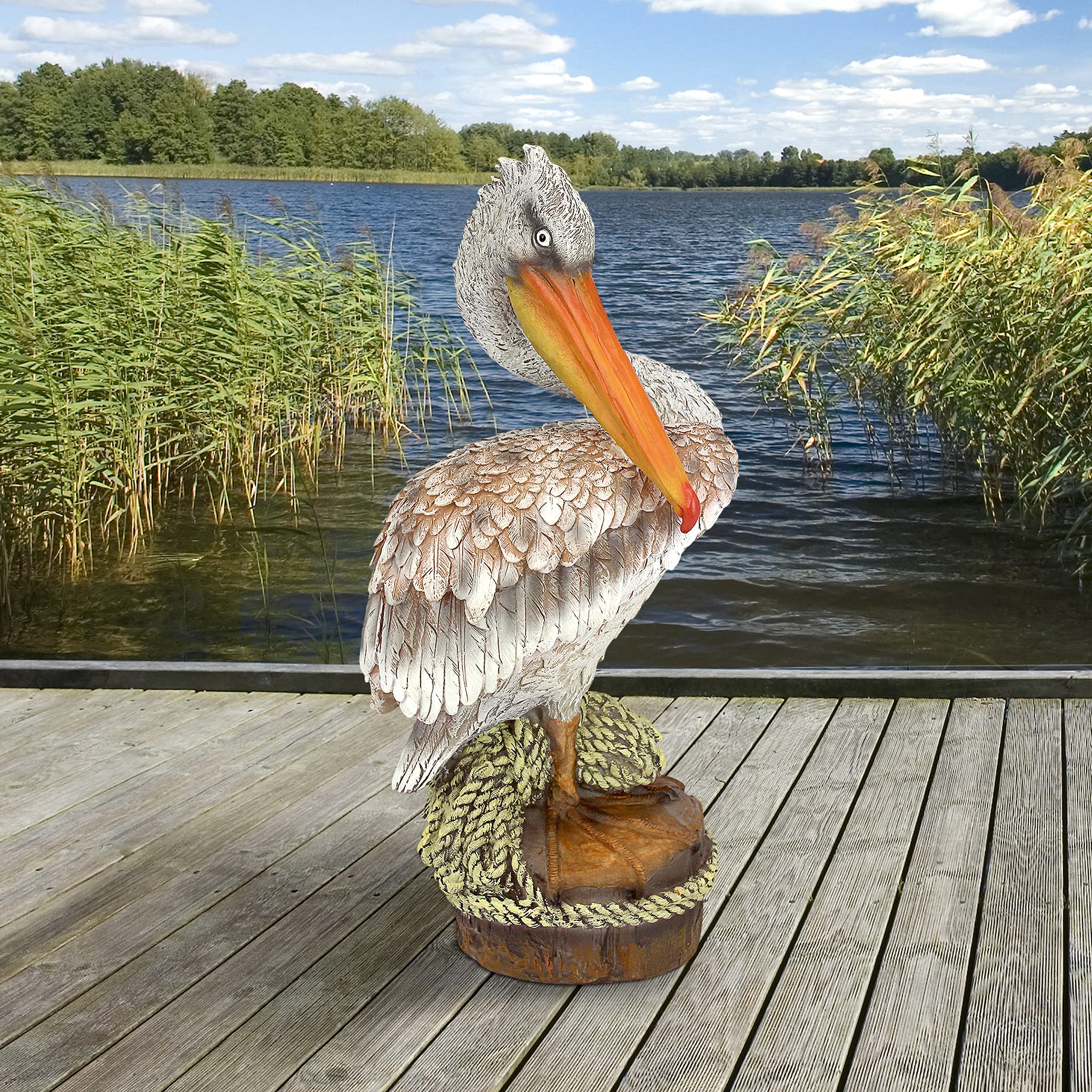 Design Toscano pelican on indoor console creating coastal room vignette