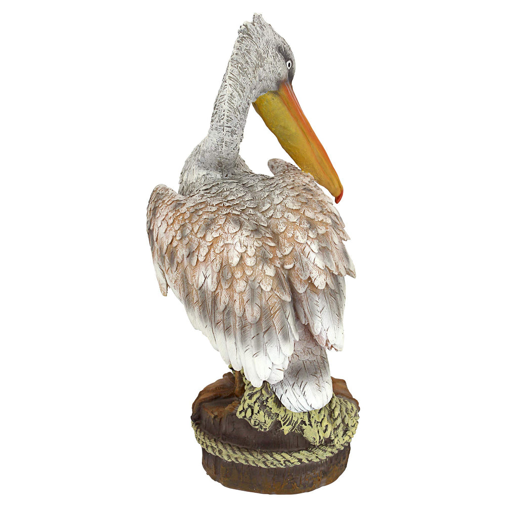 Design Toscano pelican beside pool demonstrating nautical outdoor styling