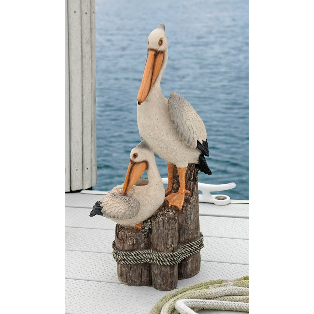 Design Toscano pelican by pool showing coastal ambiance and outdoor use