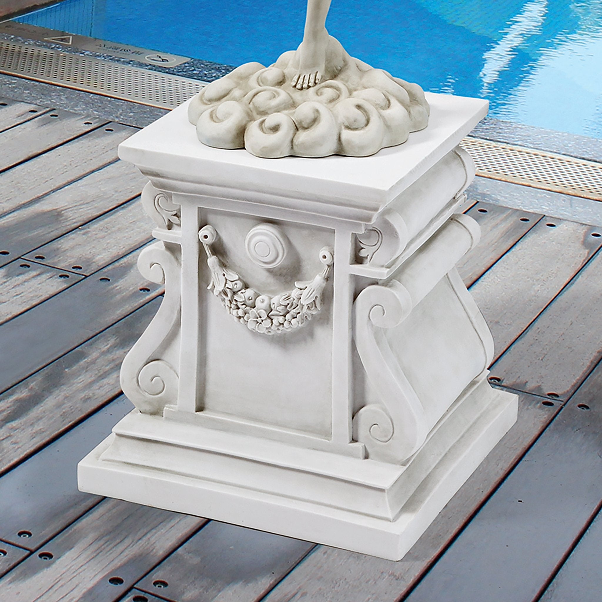 Design Toscano plinth on patio with plants showing styling and versatility benefit