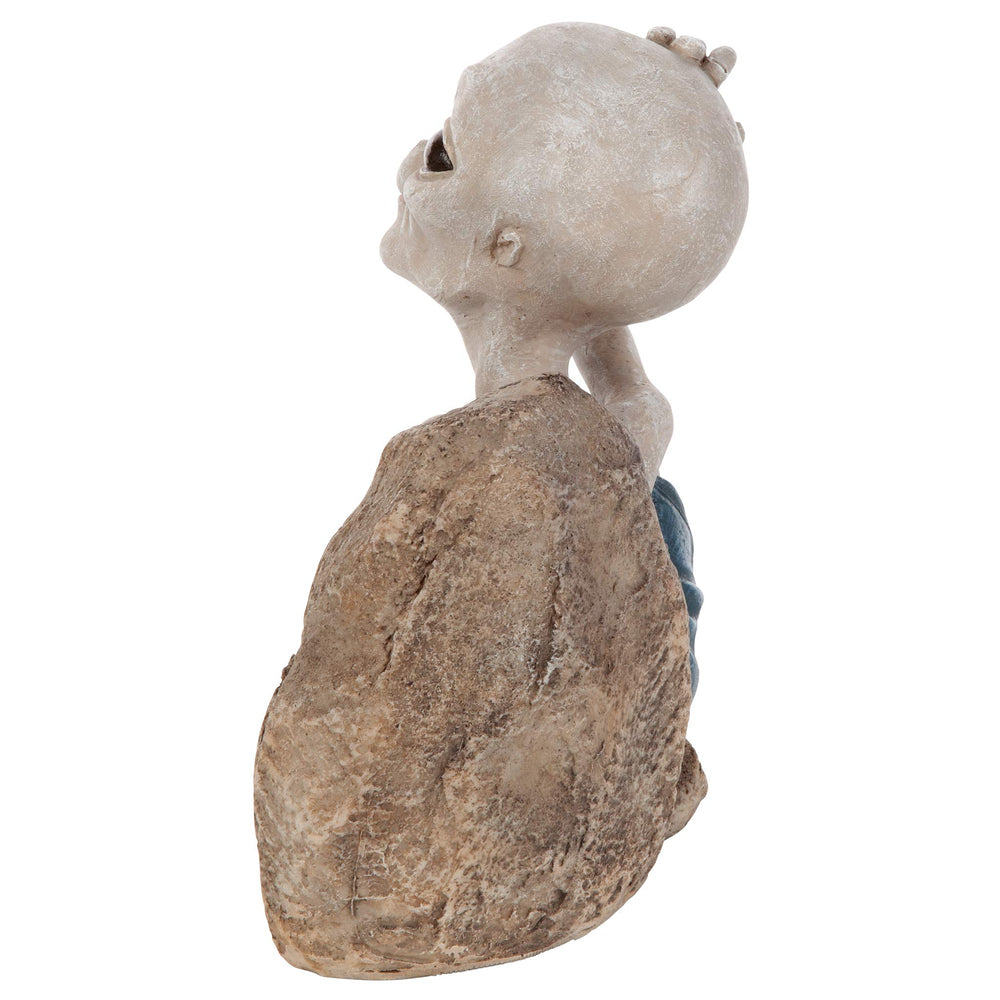 Design Toscano beside a hand to show statue scale and tabletop suitability