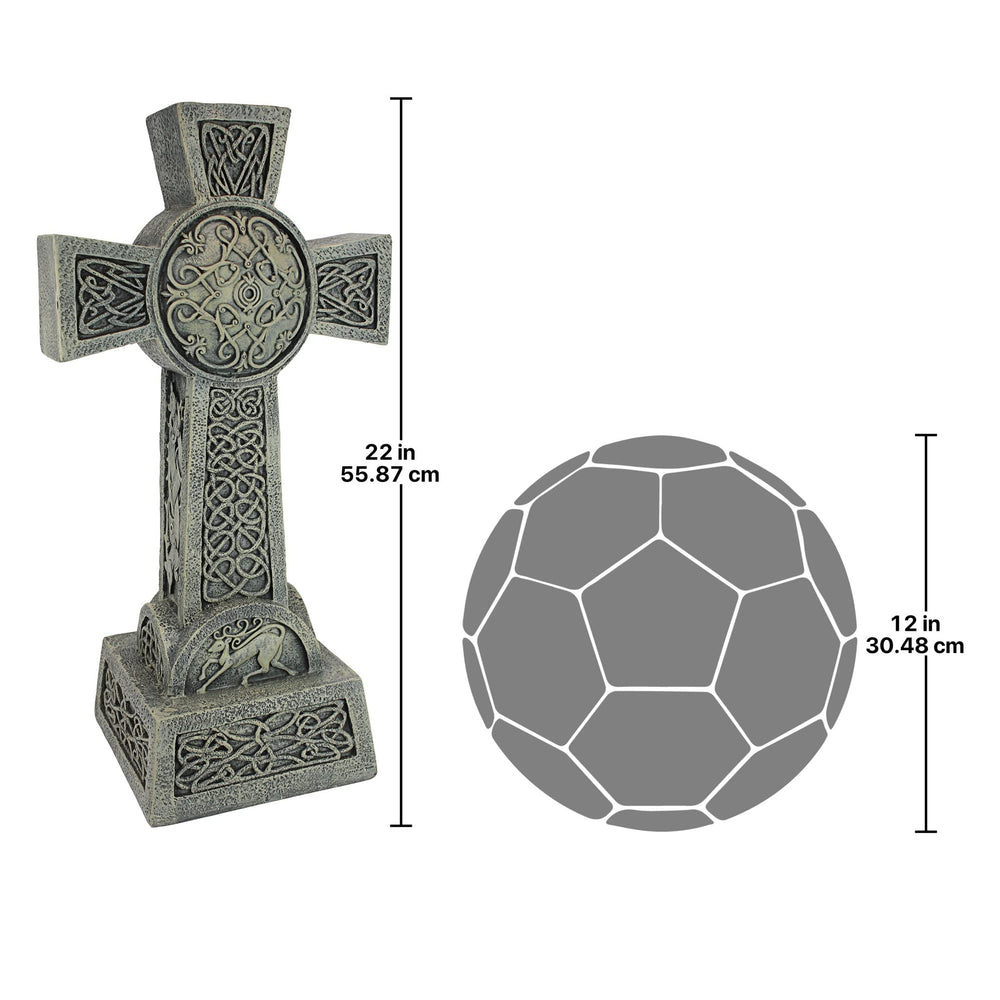 Design Toscano cross next to hand for scale illustrating 22-inch manageable memorial size