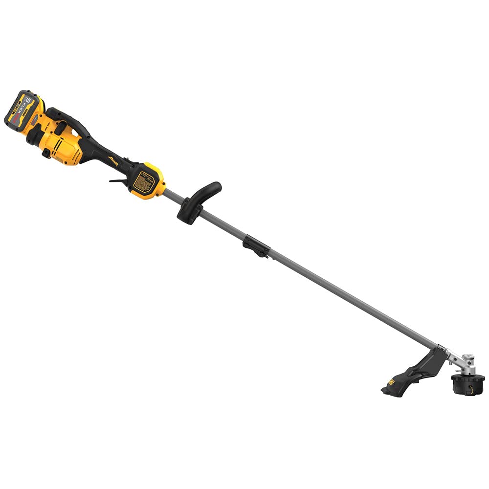 DEWALT trimmer in use edging grass showing clean trimming results