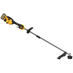 DEWALT trimmer in use edging grass showing clean trimming results