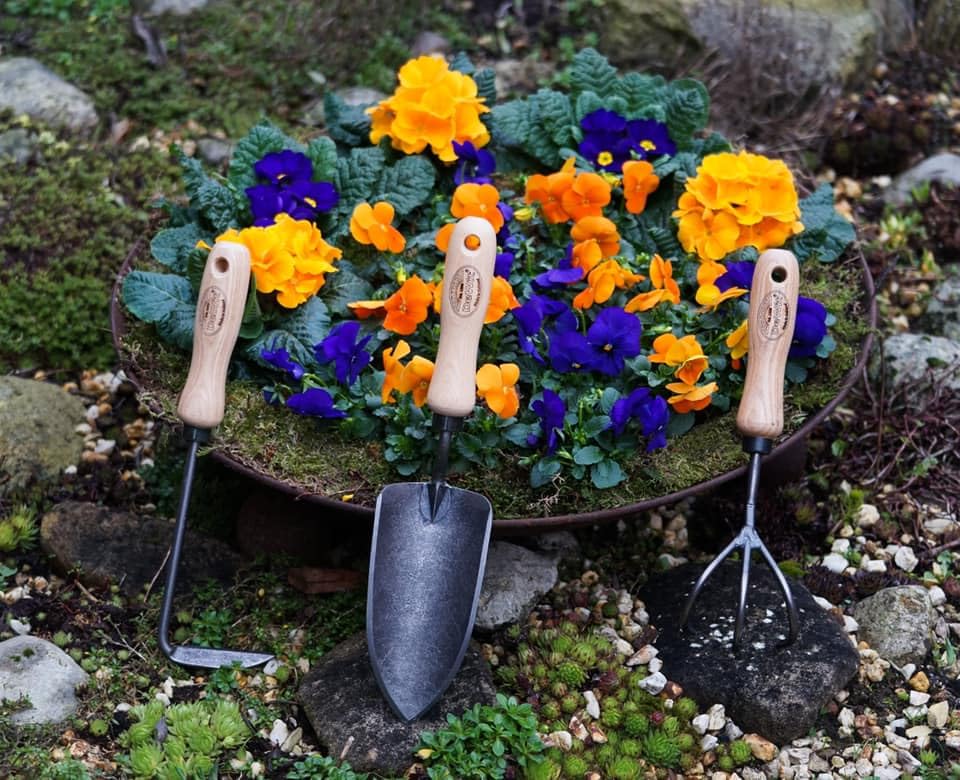 DeWit weeder cutting under mulch illustrating clean root severing advantage
